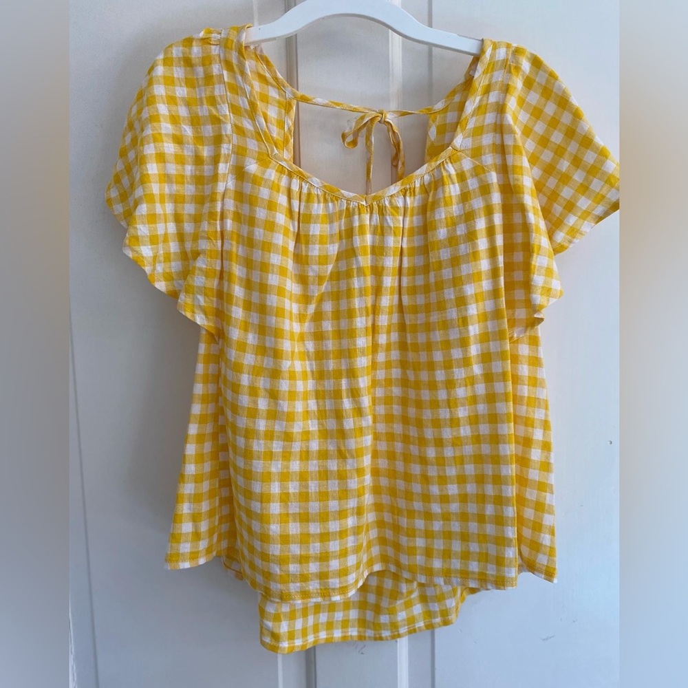 Women’s yellow and white shirt